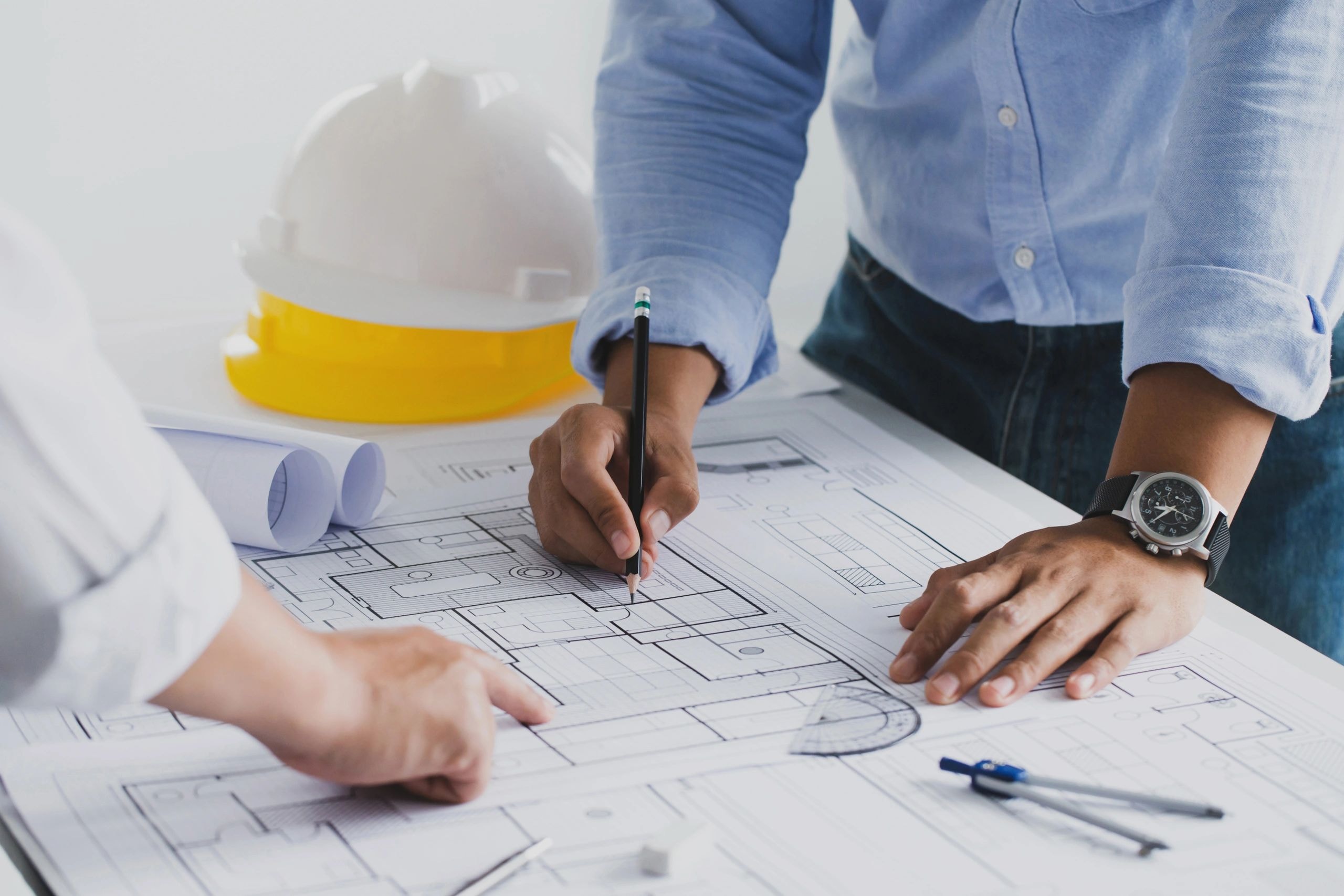 Professionals reviewing architectural blueprints